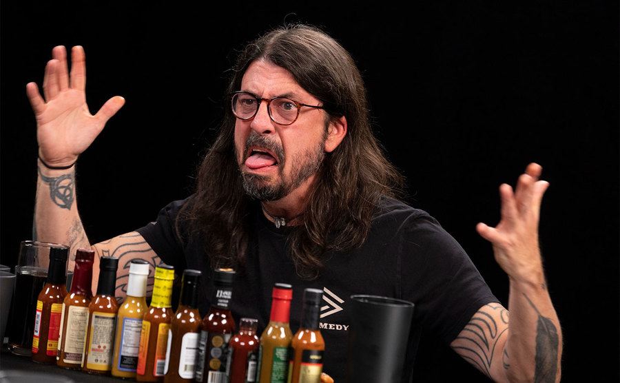 Dave Grohl makes crazy faces during his time on Hot Ones.