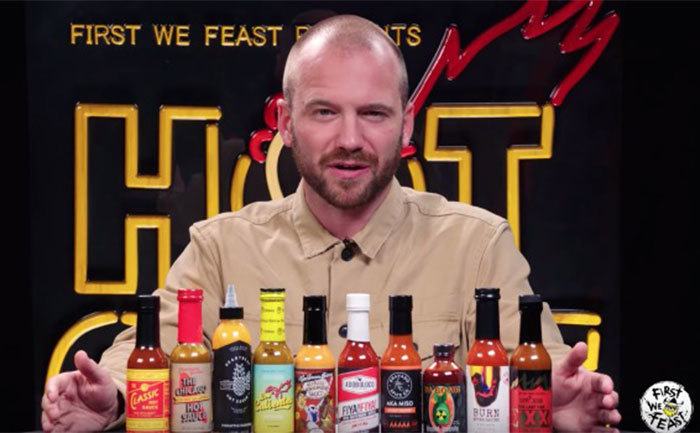 Evans shows off a hot sauce selection. 