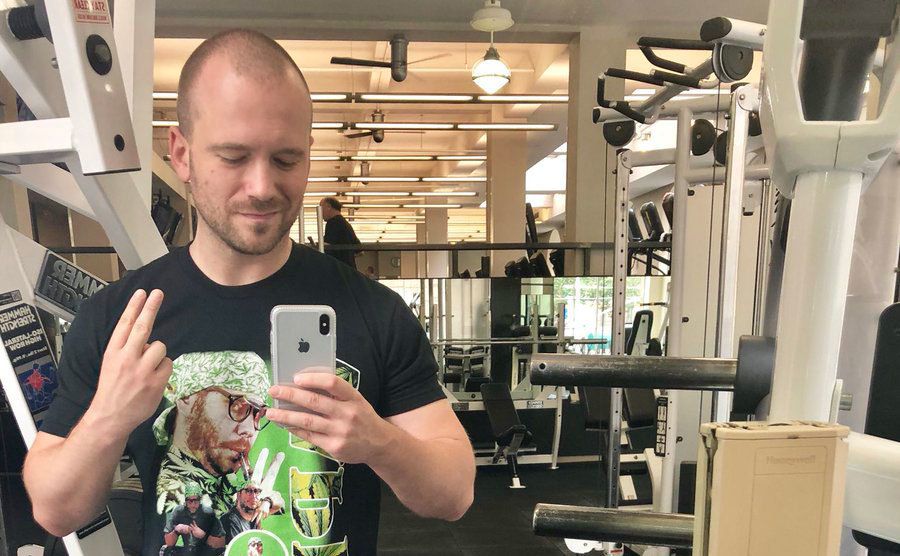 Sean Takes a gym mirror selfie. 