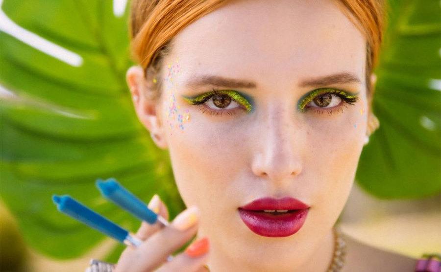 Bella Thorne poses for an ad for Forbidden Flowers