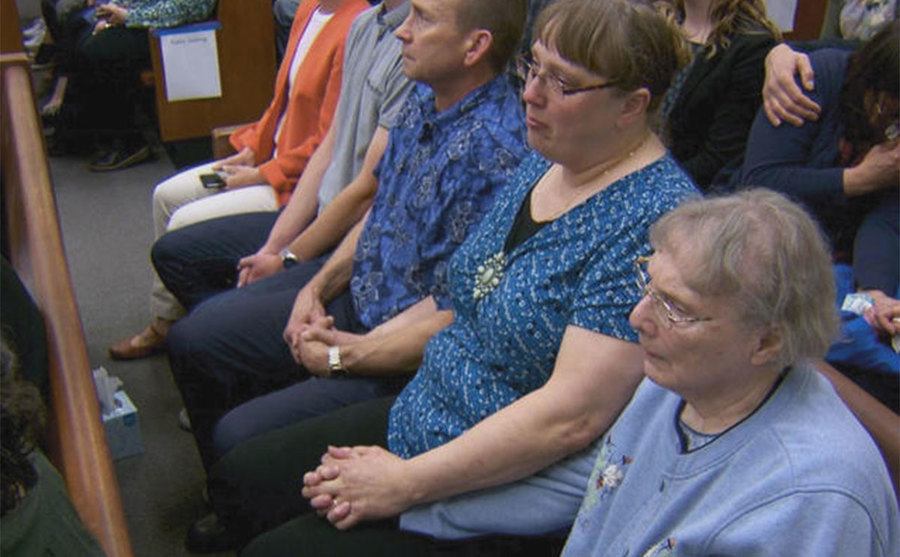 An image of Mandy’s family sitting in the courtroom.