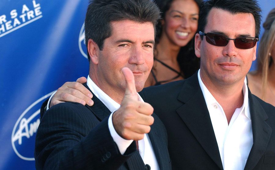 Cowell poses for the press.