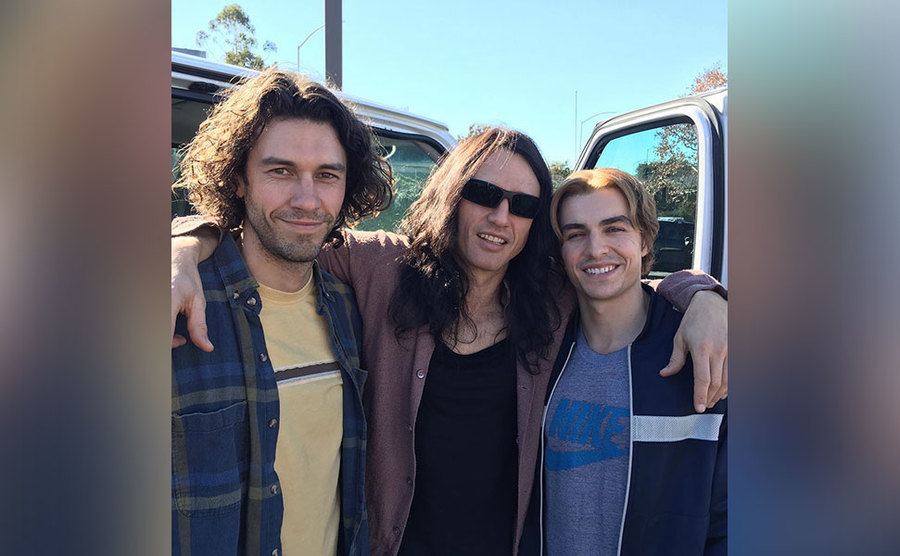 Tom, James, and Dave pose for a photo behind the scenes of The Disaster Artist. 