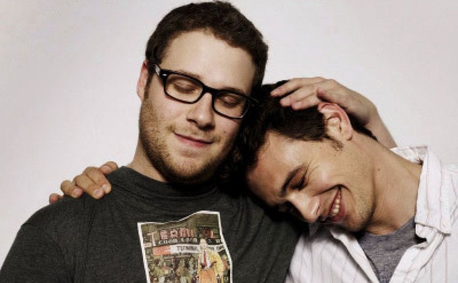 Seth Rogen and James Franco embrace. 