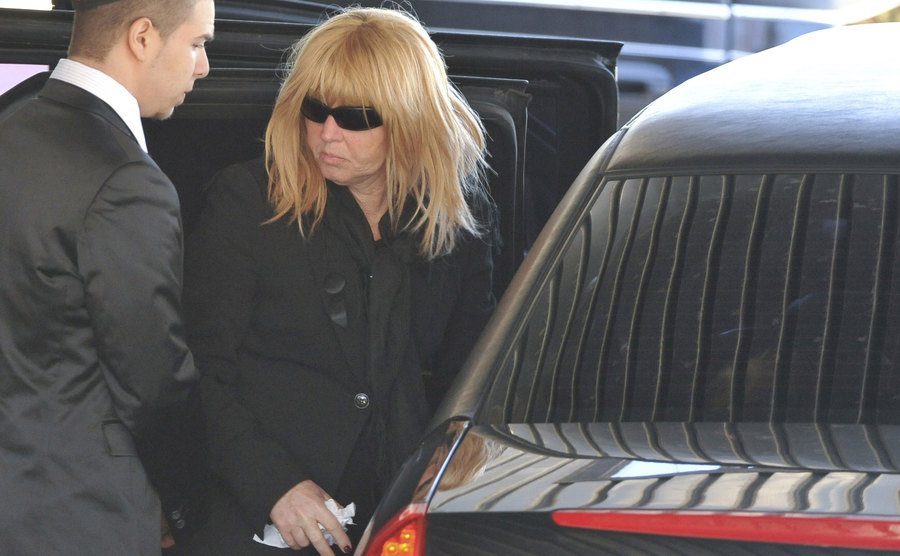A picture of Judy arriving at her son’s funeral.