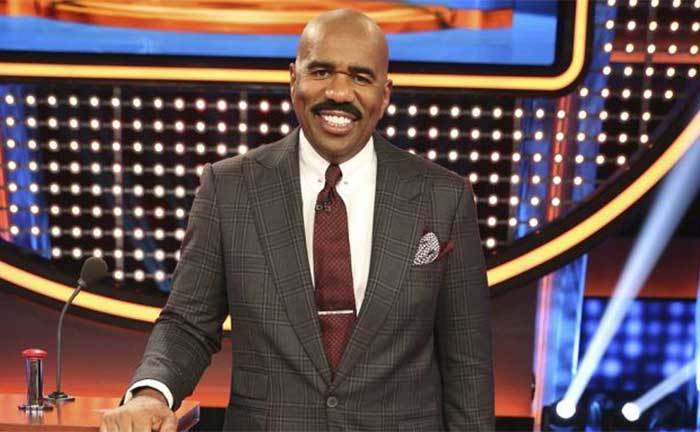 Steve Harvey poses on the set of Family Feud. 