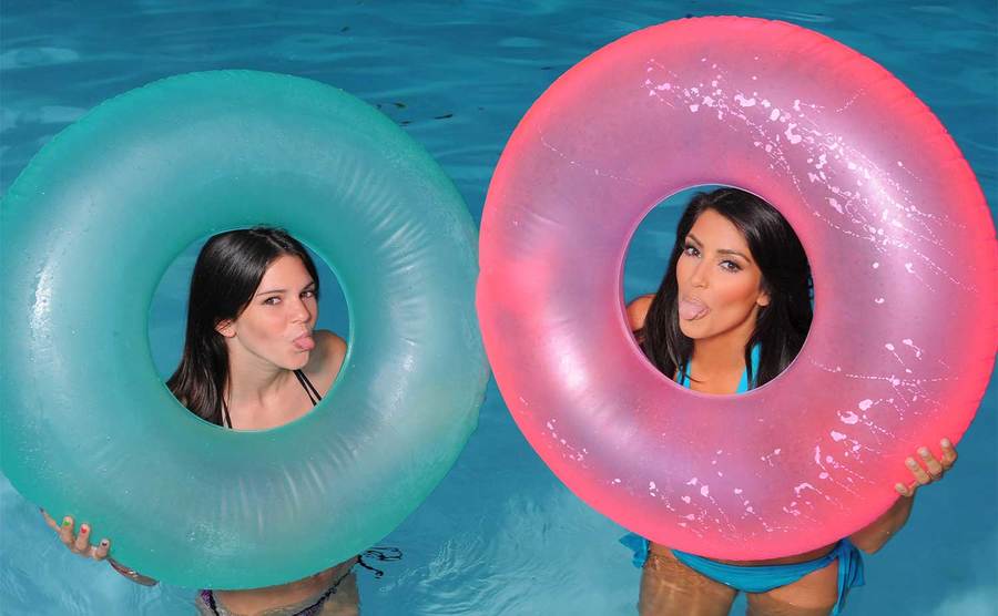 Kendall and Kim pose during a photoshoot in the pool. 
