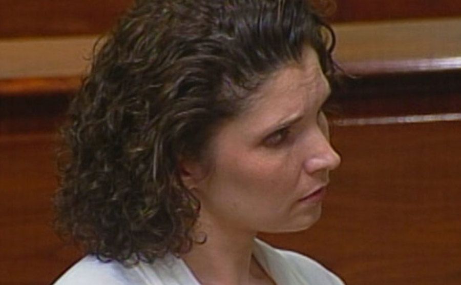 An image of Melanie sitting in court during the trial.