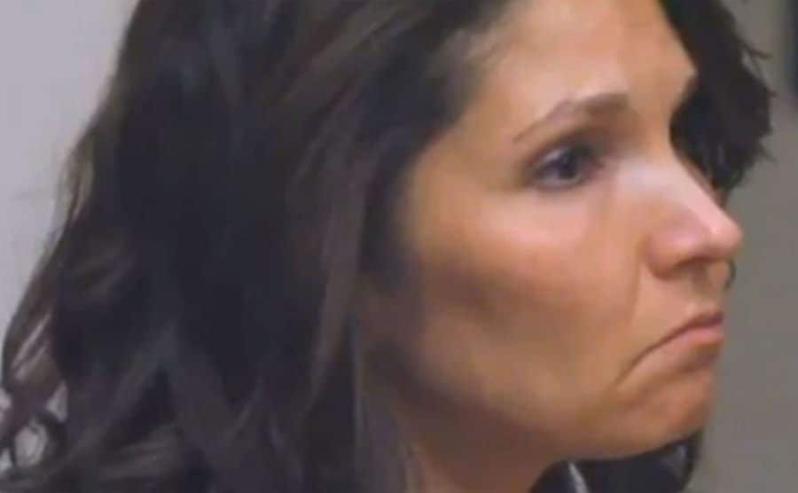 A photo of Melanie looking sad during the trial.