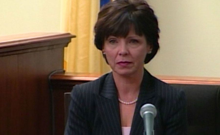 A still of Cindy testifying in court.