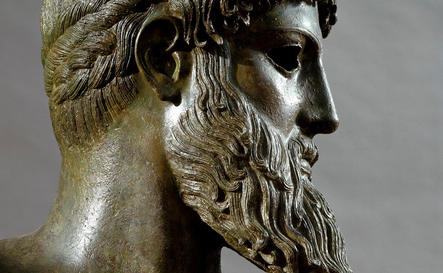 A bronze sculpture of Poseidon.