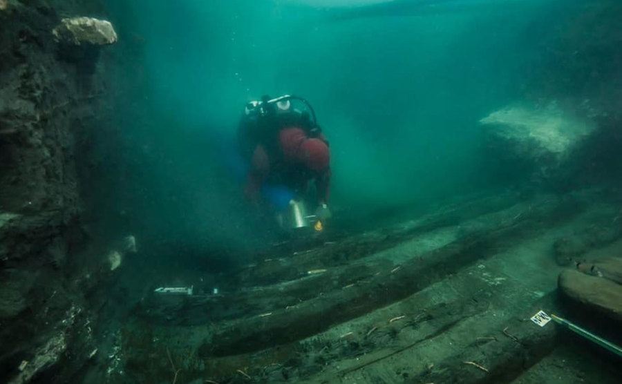 An image of underwater remains of an ancient military vessel.