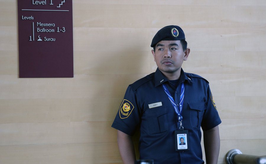 A member of the Malaysian Airlines police stands guards at an airport.