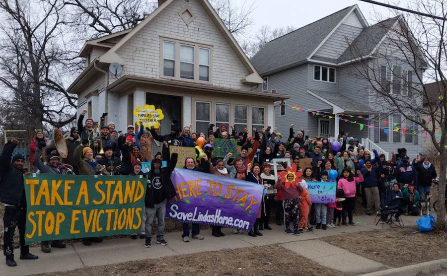 Neighbors protest over an elderly eviction from her home.