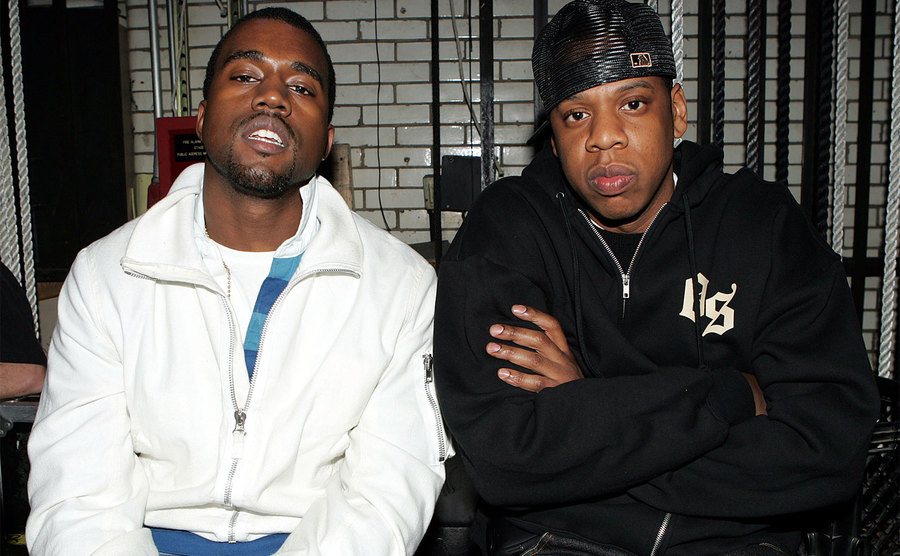 Kanye West and Jay Z relax backstage. 