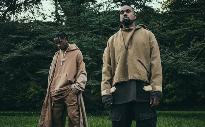 Travis Scott and Kanye West pose together. 