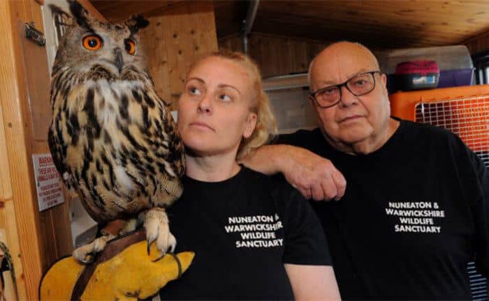 Geoff Grewcock and his daughter pose with an owl. 