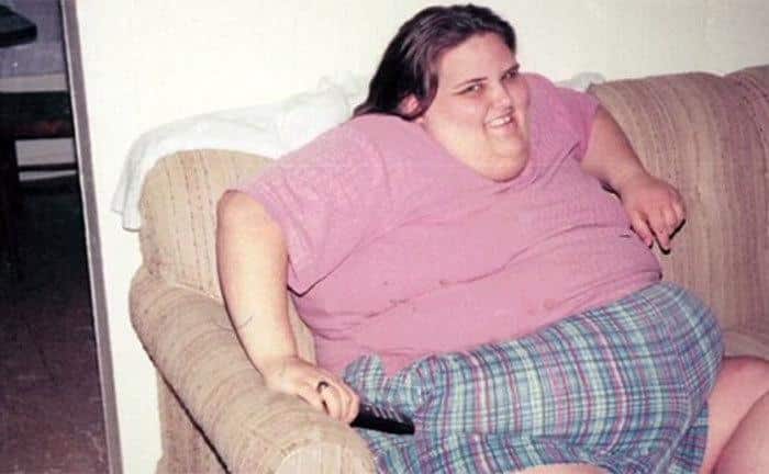 A photo of Susan Farmer watching tv at home. 