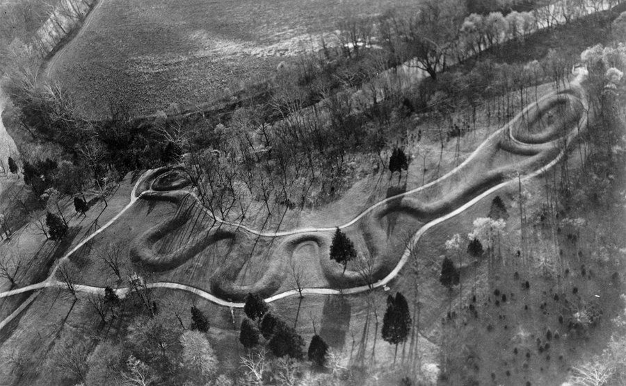 The Great Serpent Mound is nearly a quarter of a mile long and represents a giant snake holding an egg in its jaws.