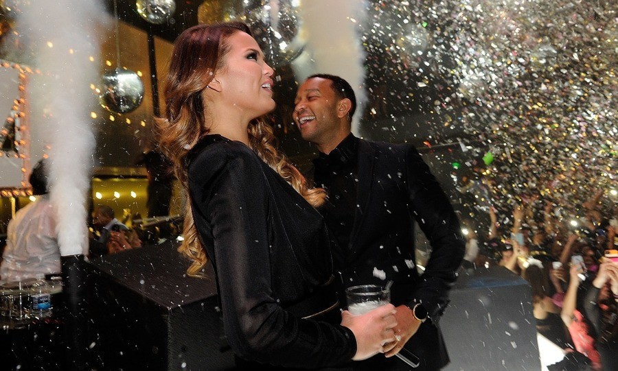 Model Chrissy Teigen (L) and singer John Legend celebrate New Year's Eve